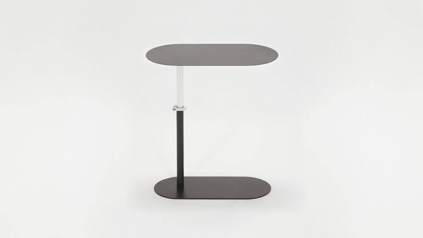 Side view of the Finn adjustable floating side table, adjusted to tall, in black