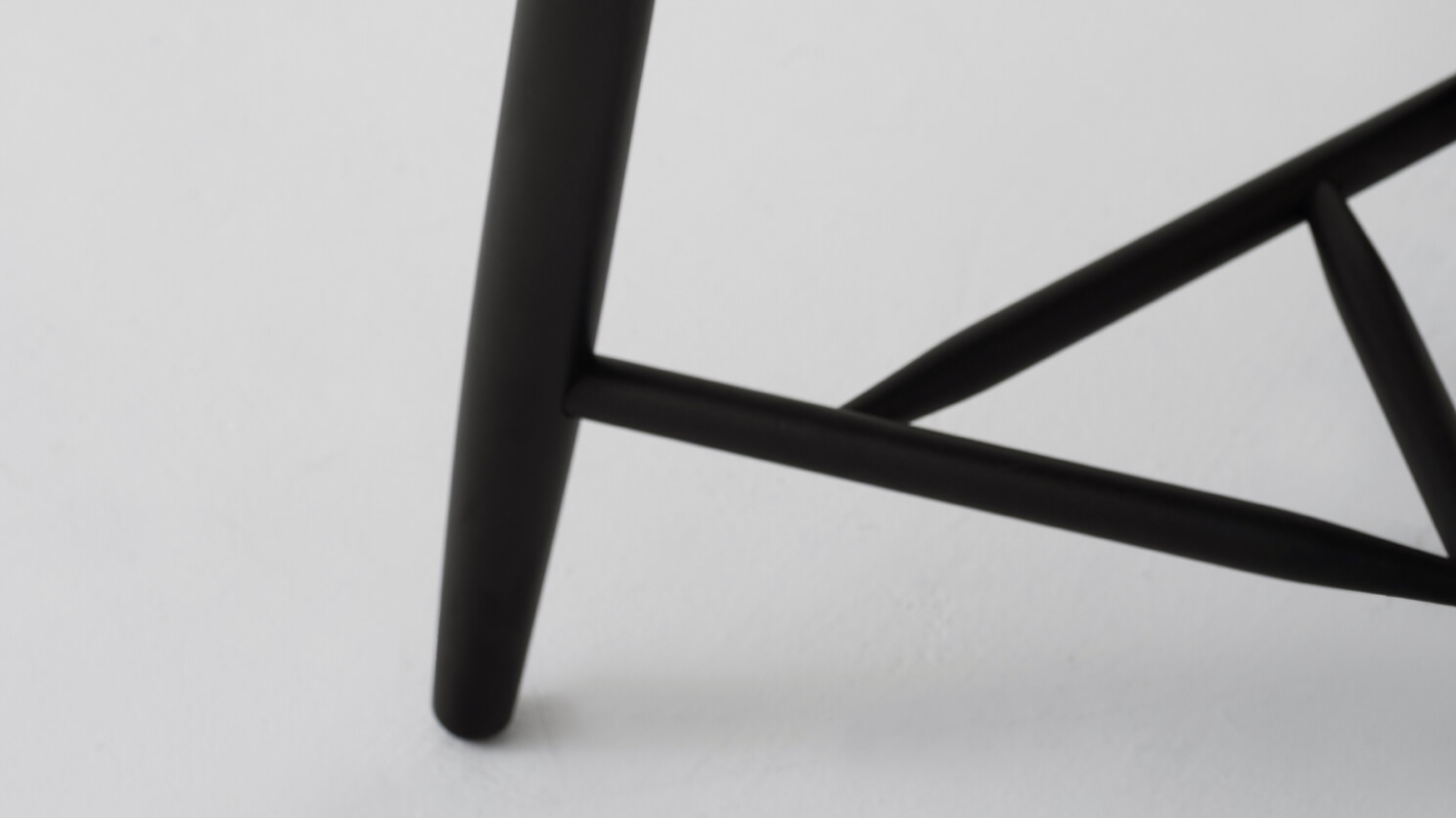 Detail view of the Kacia modern end table in black