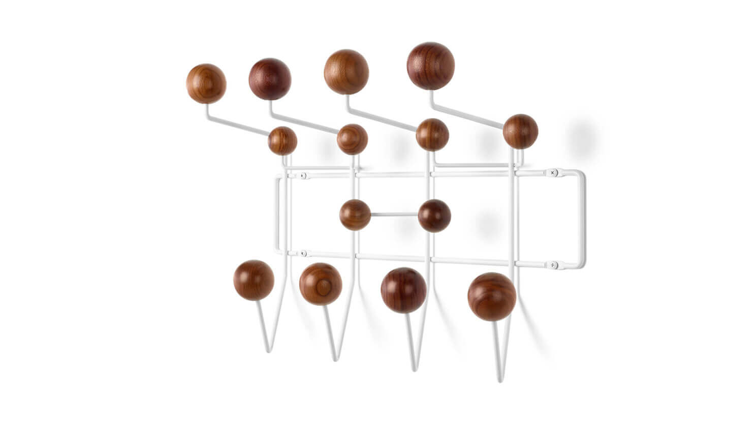 Angled view of the eames hang it all rack in white with walnut hooks