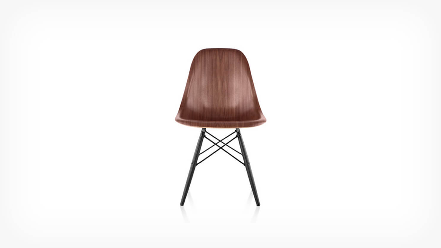 Front view of walnut seat and black base Eames dining chair