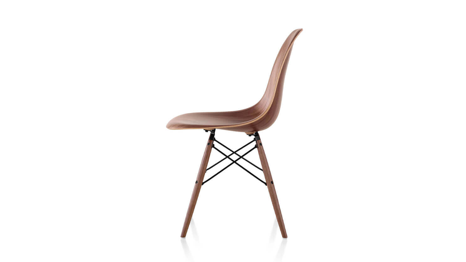 Side view of walnut seat and base Eames dining chair