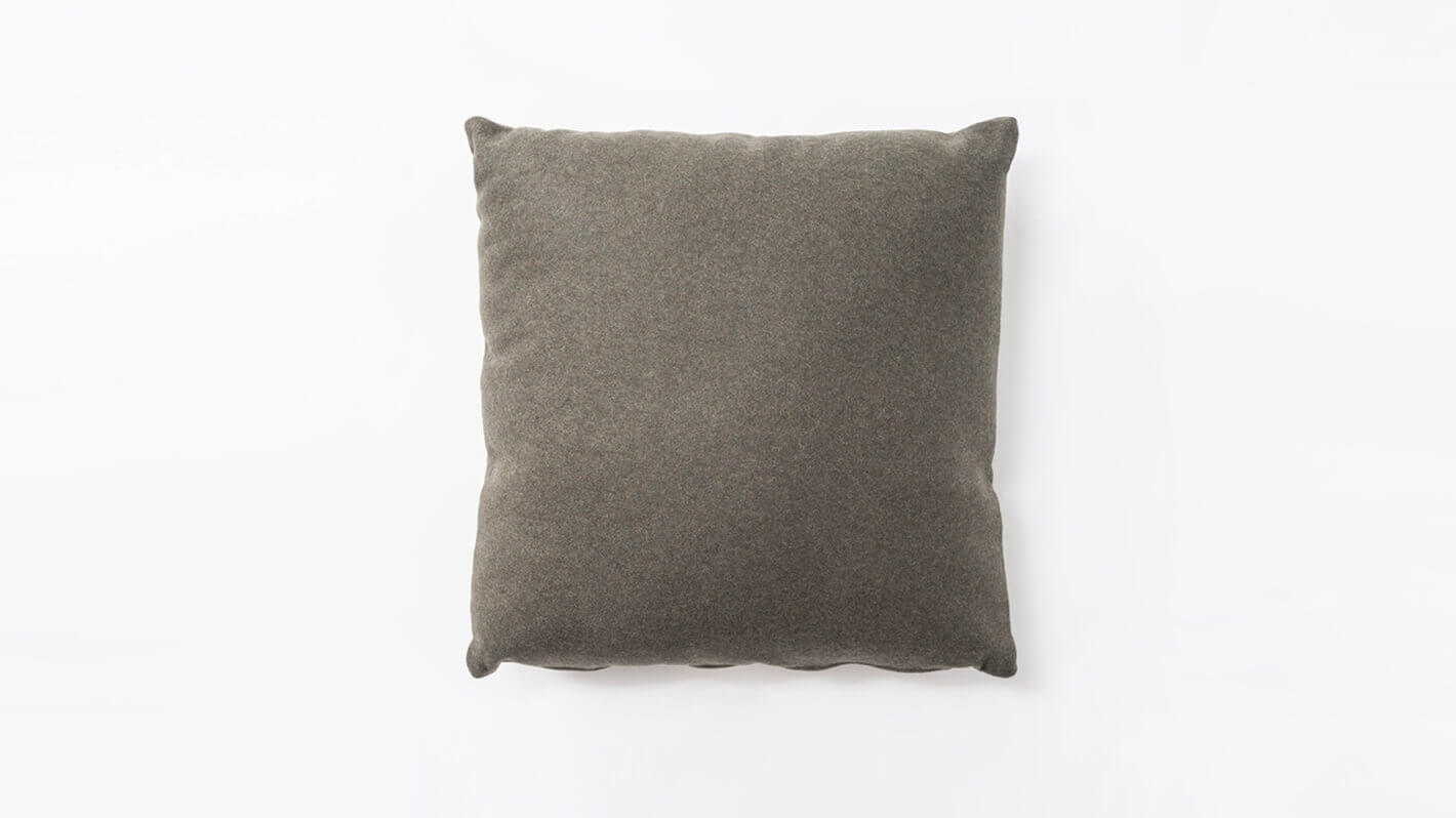 Square pillow upholstered in grey fabric front view