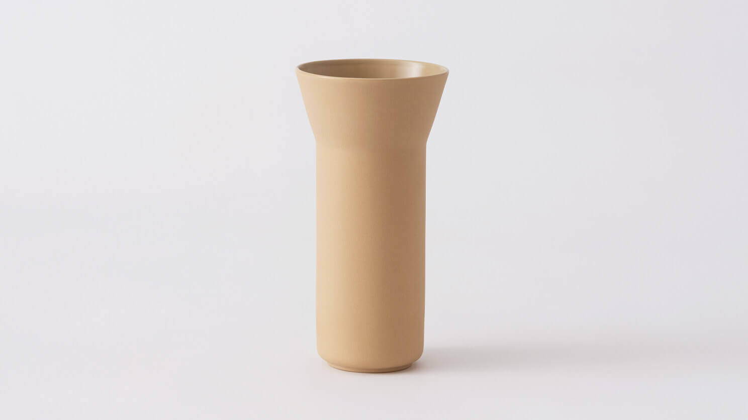 Front view of large beige ceramic vase