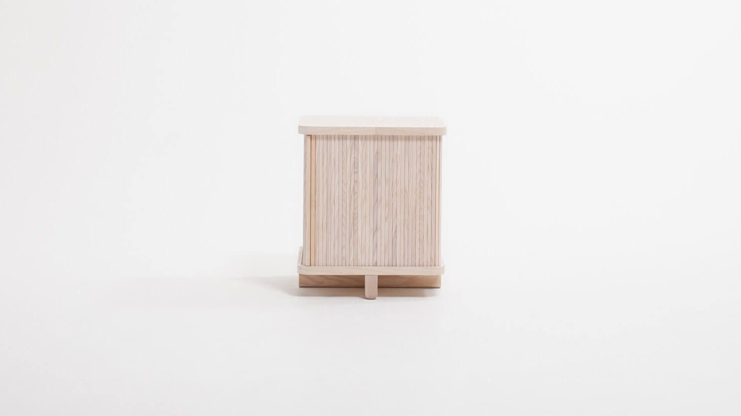 Front view of the Tambour modern end table in ash