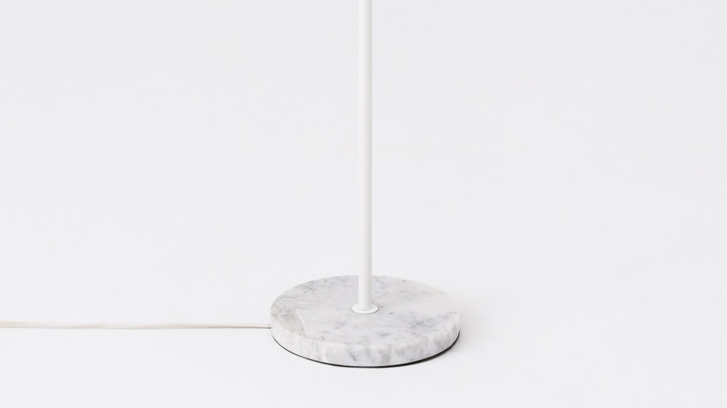 Detail view of the Grove Opal living room floor lamp white marble base