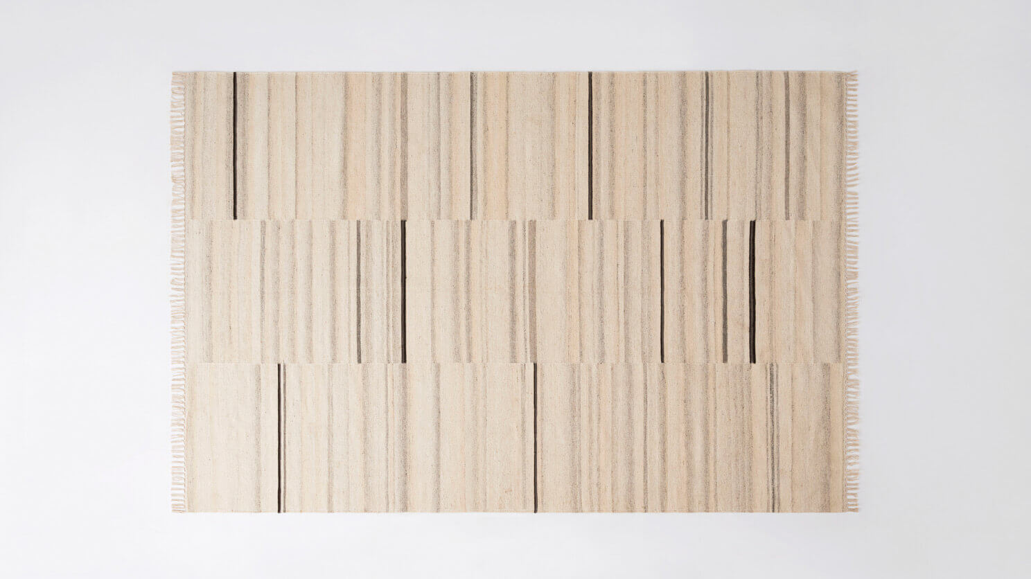 Ivory area rug with grey and black stripes top view