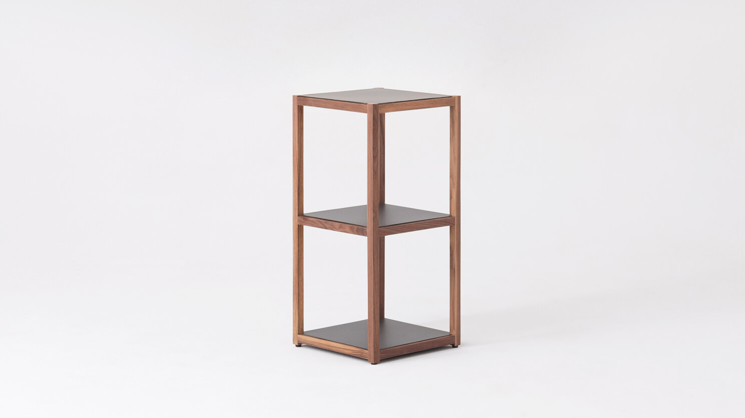 Angled view of the short square Grow room divider bookcase in charcoal and walnut