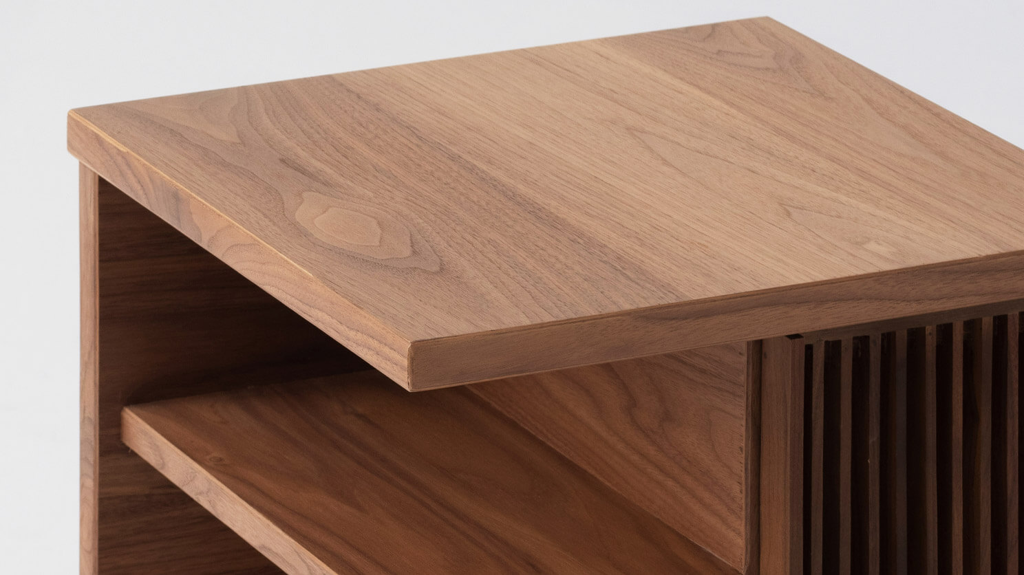 Detail right view of the Plank accent table canada in walnut with slats