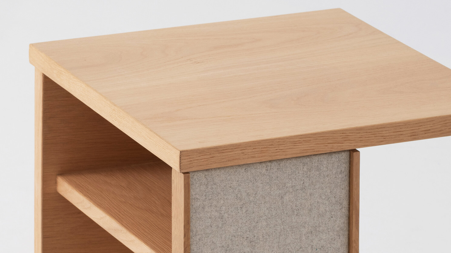 Detail left view of the Plank accent table canada in oak with fabric panels