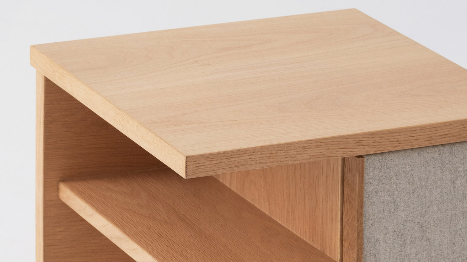 Angled right view of the Plank accent table canada in oak with fabric panels