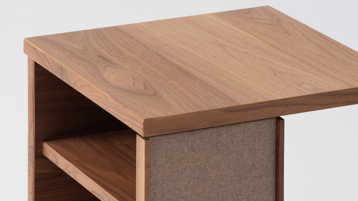 Detail left view of the Plank accent table canada in walnut with fabric panels