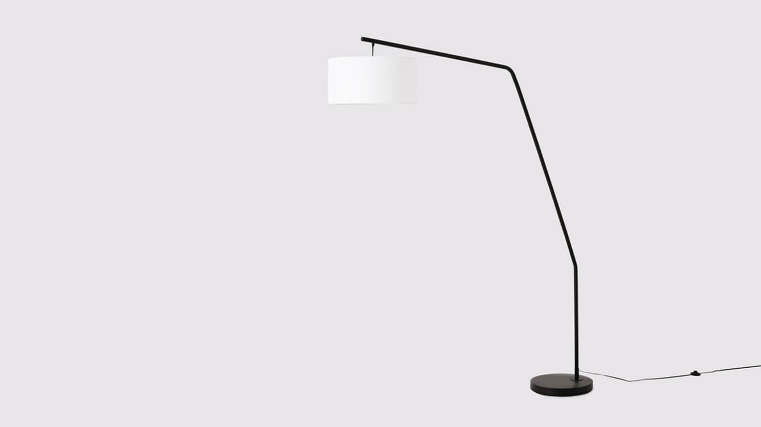 The Yumi living room floor lamp with black stand and white shade