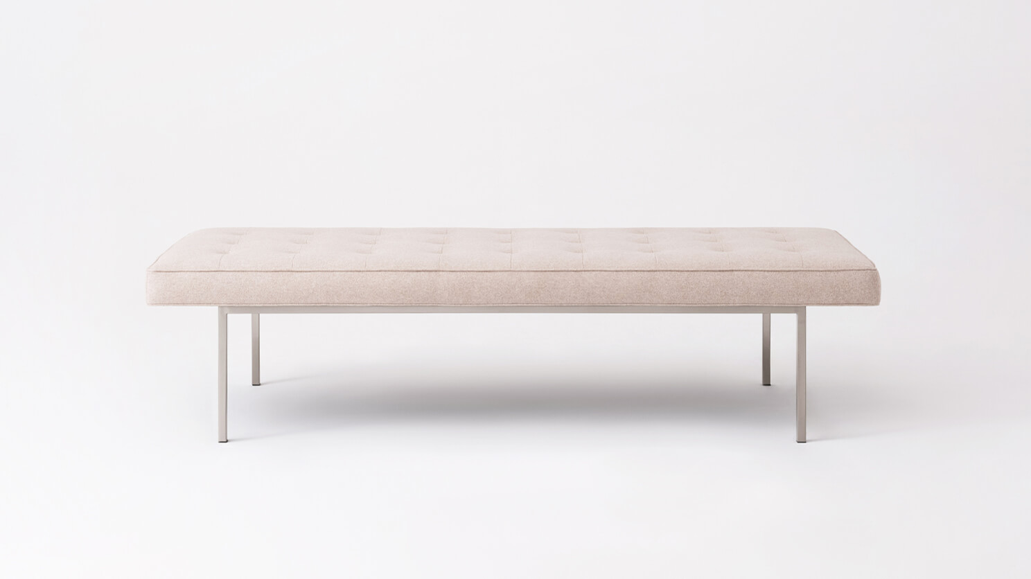 Side view of the Bank upholstered dining bench in beige fabric