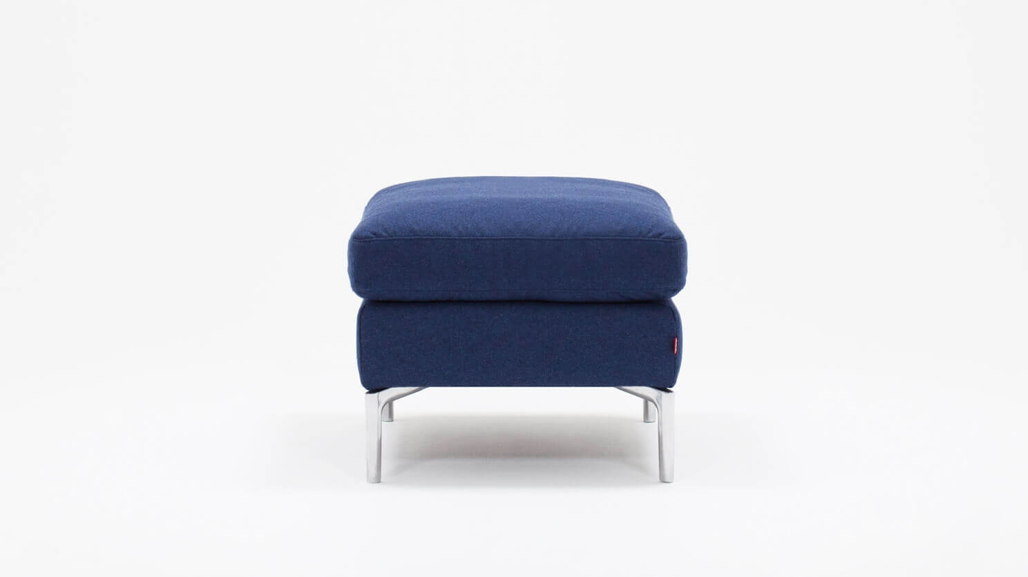 Side view of the Eve mid century ottoman in blue fabric