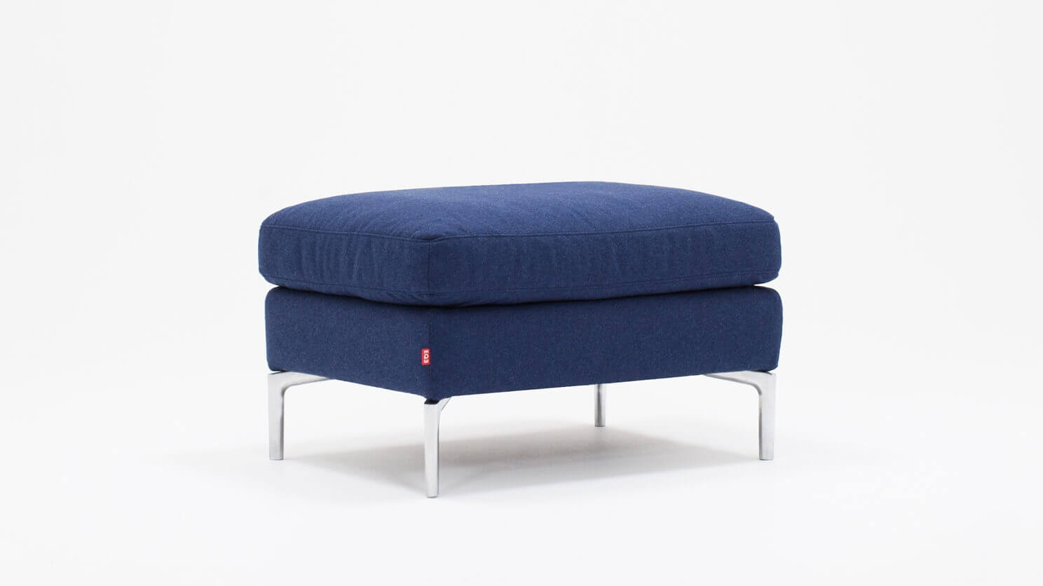 Angled view of the Eve mid century ottoman in blue fabric