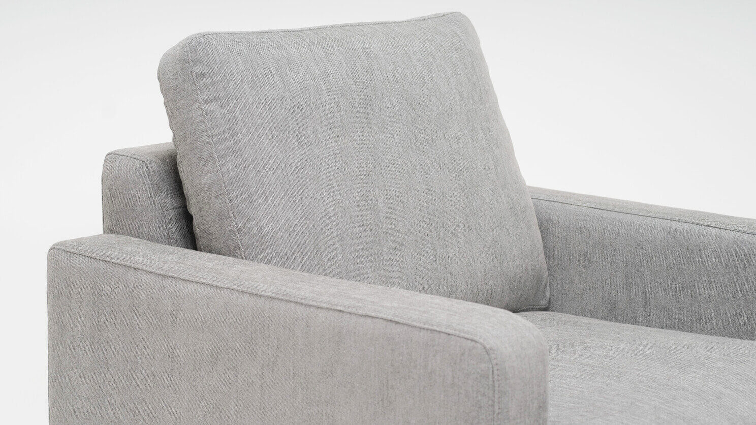 Detail view of the Eve modern accent chair in grey fabric