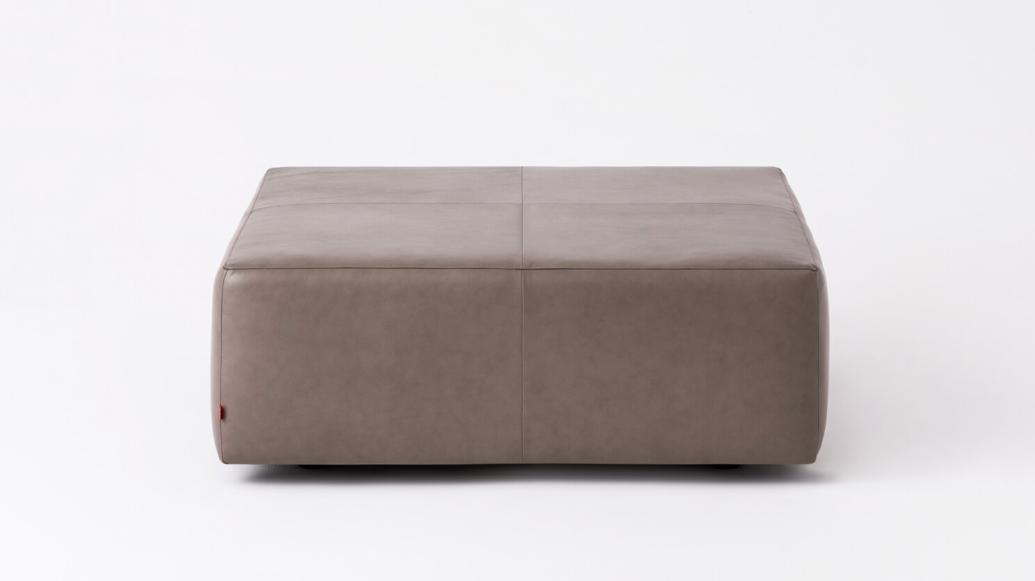 Front view of the Morten mid century ottoman in grey leather