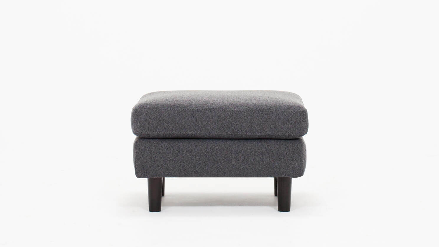 Front view of the Oskar modern ottoman in grey fabric