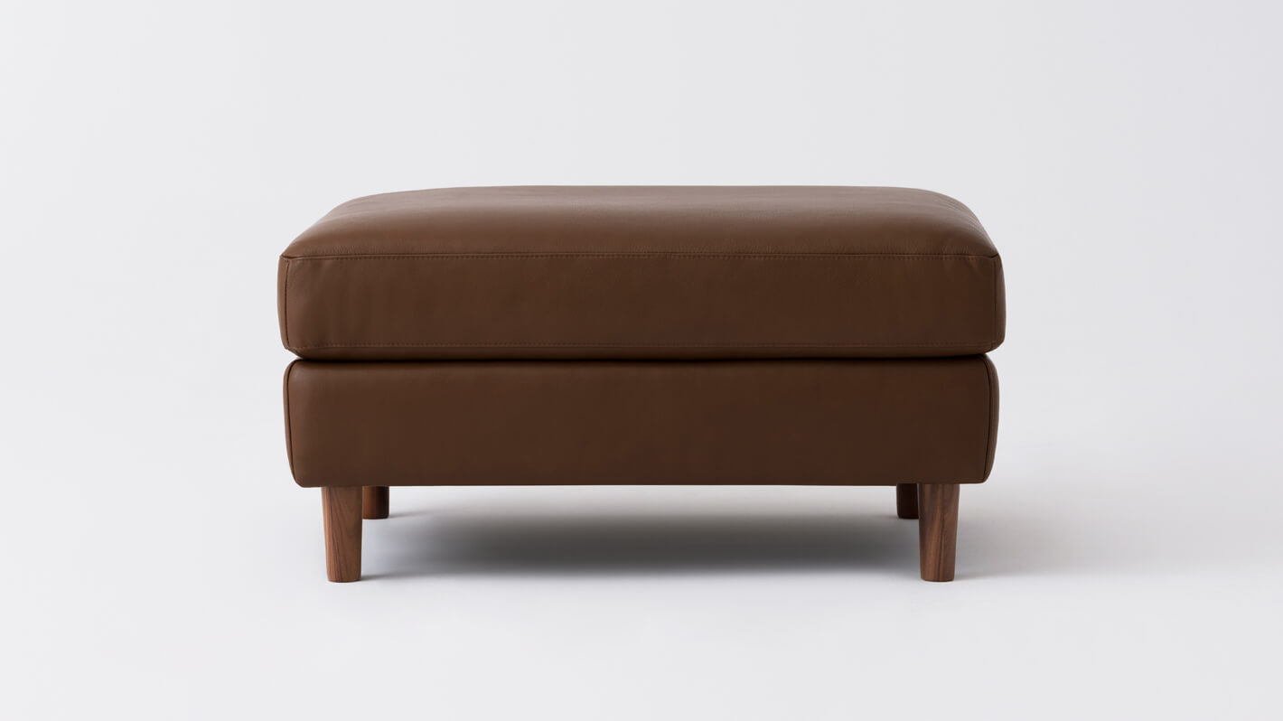 Front view of the Oskar modern ottoman in brown leather