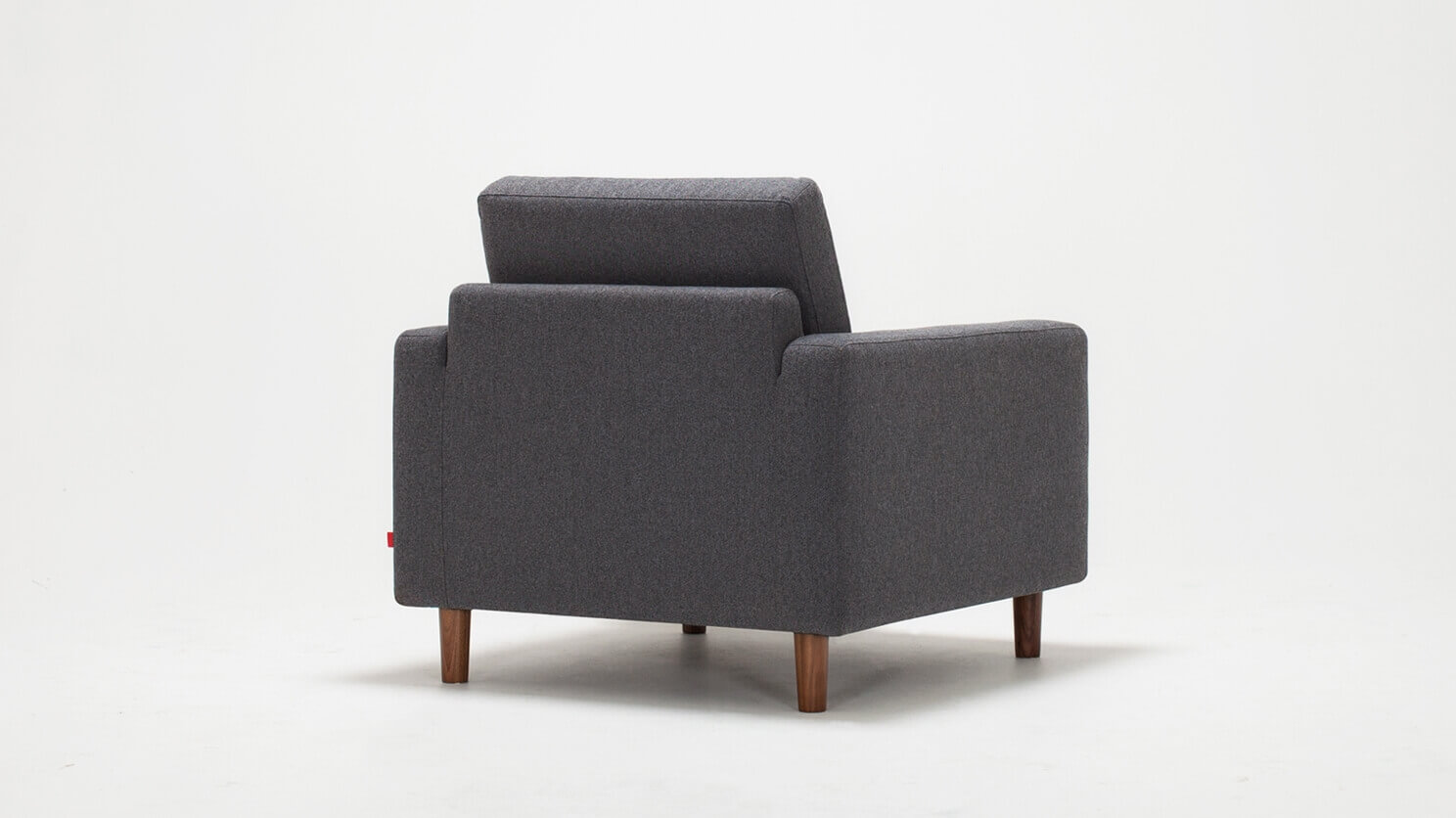 Back view of the Oskar modern lounge chair in grey fabric