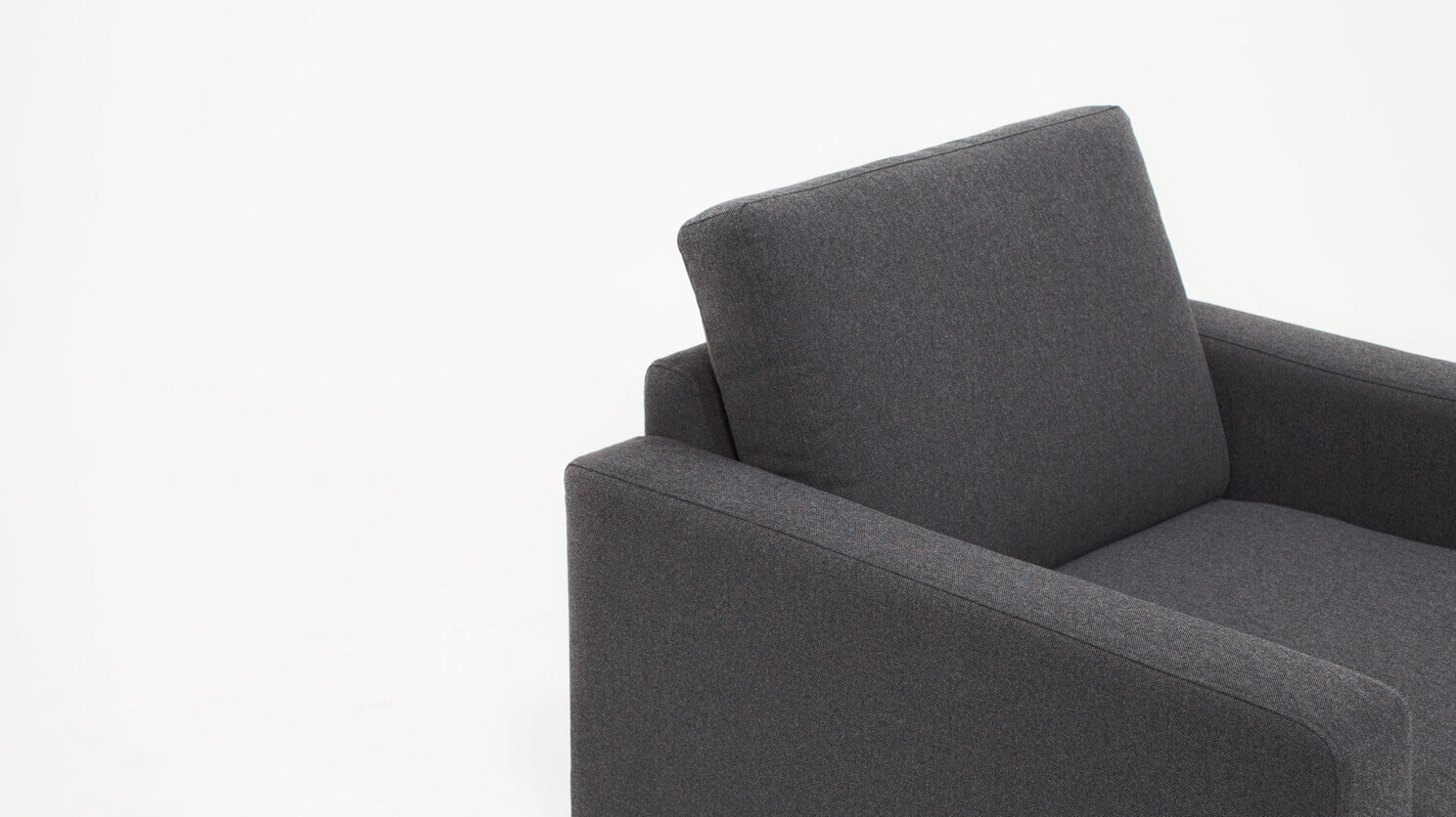 Detail view of the Oskar modern lounge chair in grey fabric