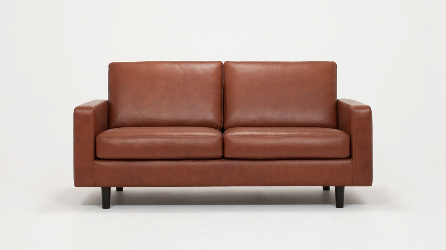 Front view of the Oskar modern loveseat in brown leather