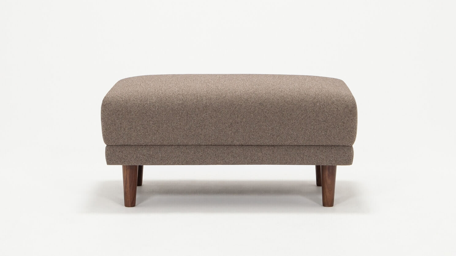 Front view of the Remi modern ottoman in beige fabric