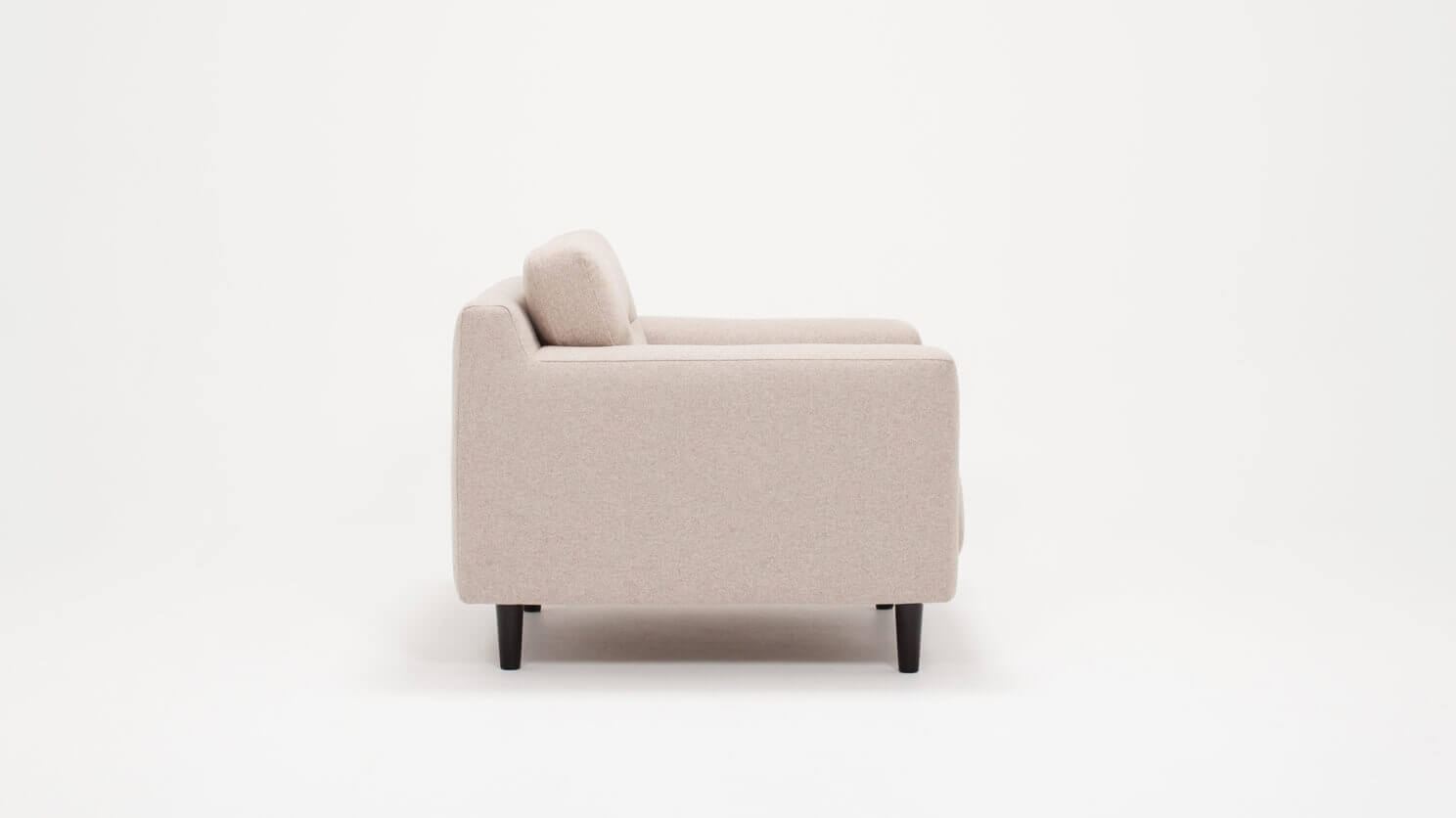 Side view of the Remi mid century modern lounge chair with horizontal pull in beige fabric