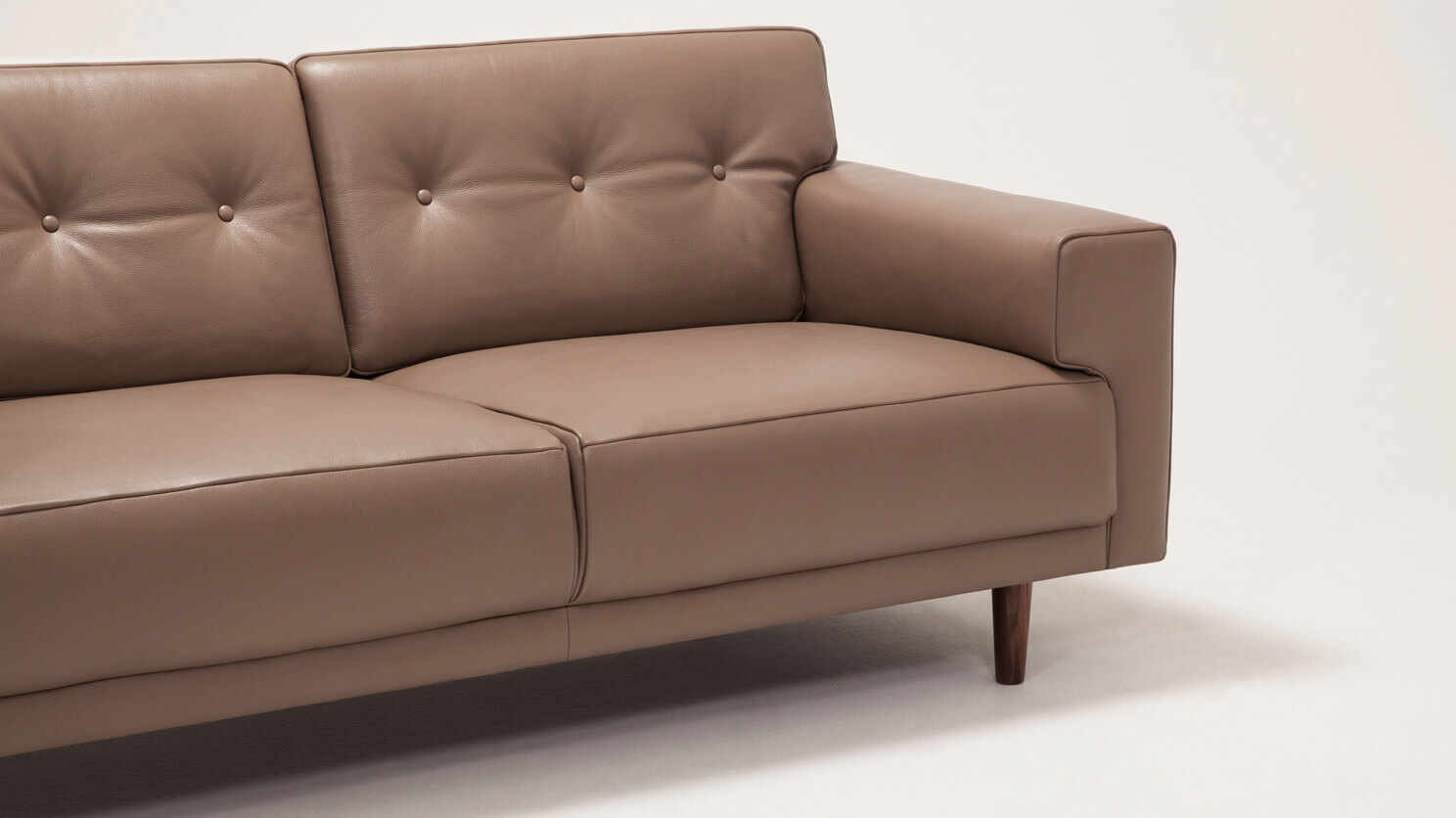 Right arm view of the Remi modern loveseat with buttons in grey leather