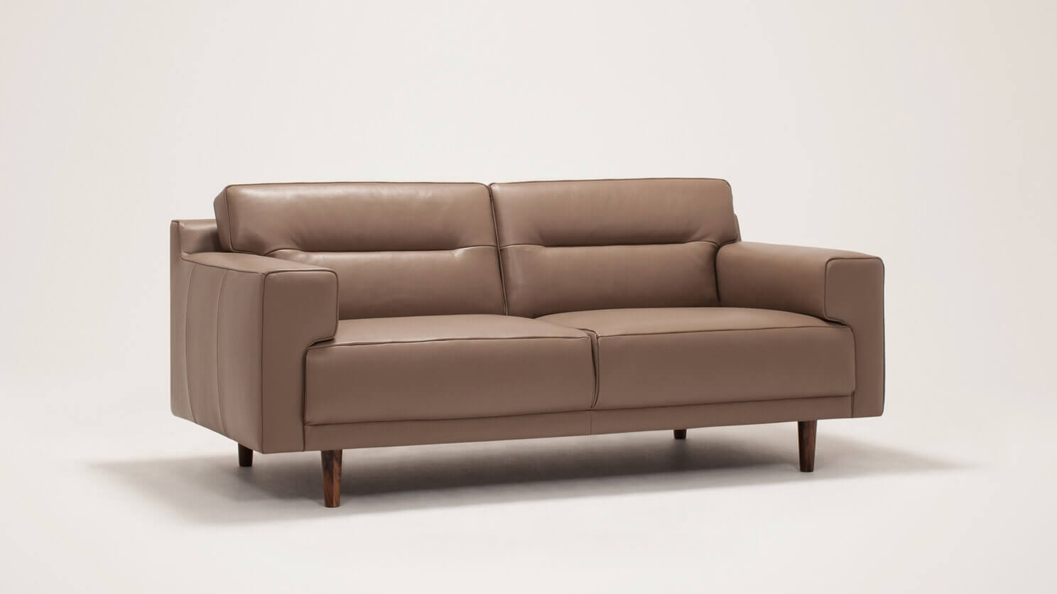 Angled view of the Remi modern loveseat with horizontal pull in grey leather