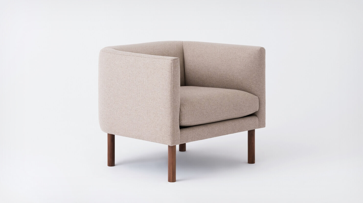 Angled view of the Replay modern club accent chair in beige fabric