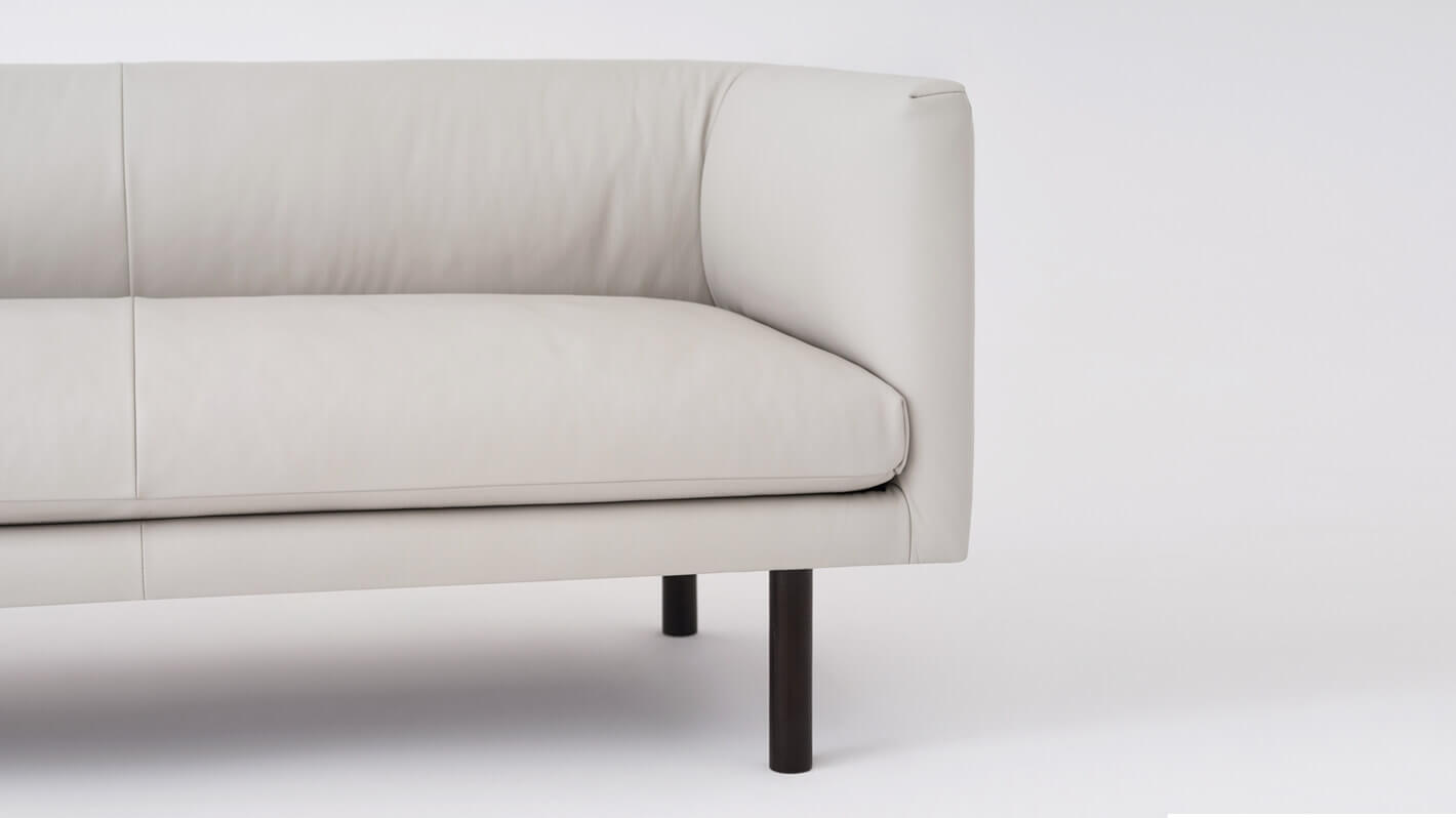 Detail view of the Replay modern club loveseat in white leather