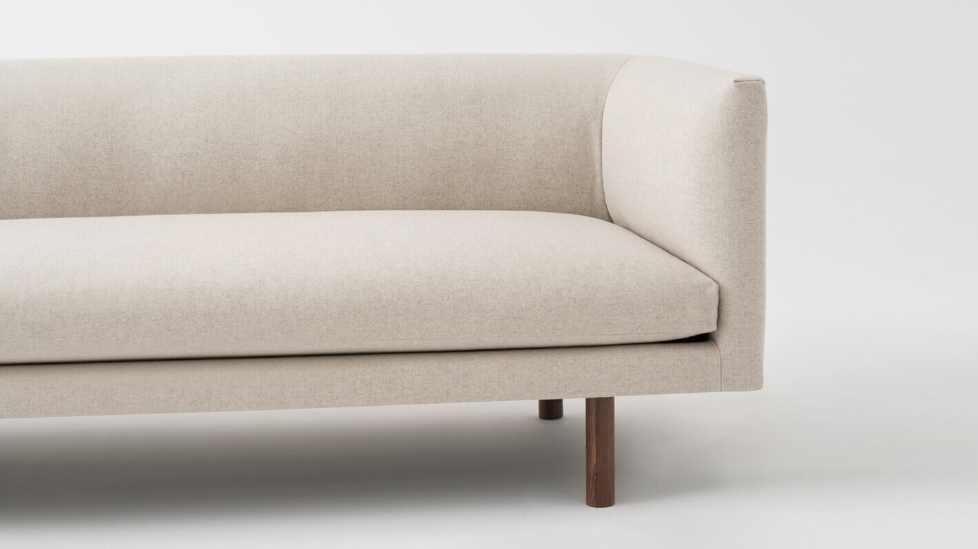 Detail view of the Replay modern club couch in white fabric