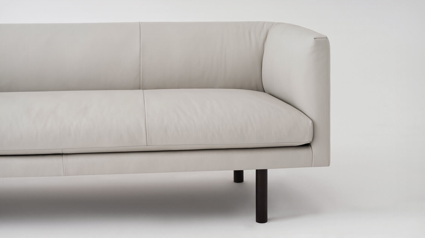 Detail view of the Replay modern club couch in grey leather