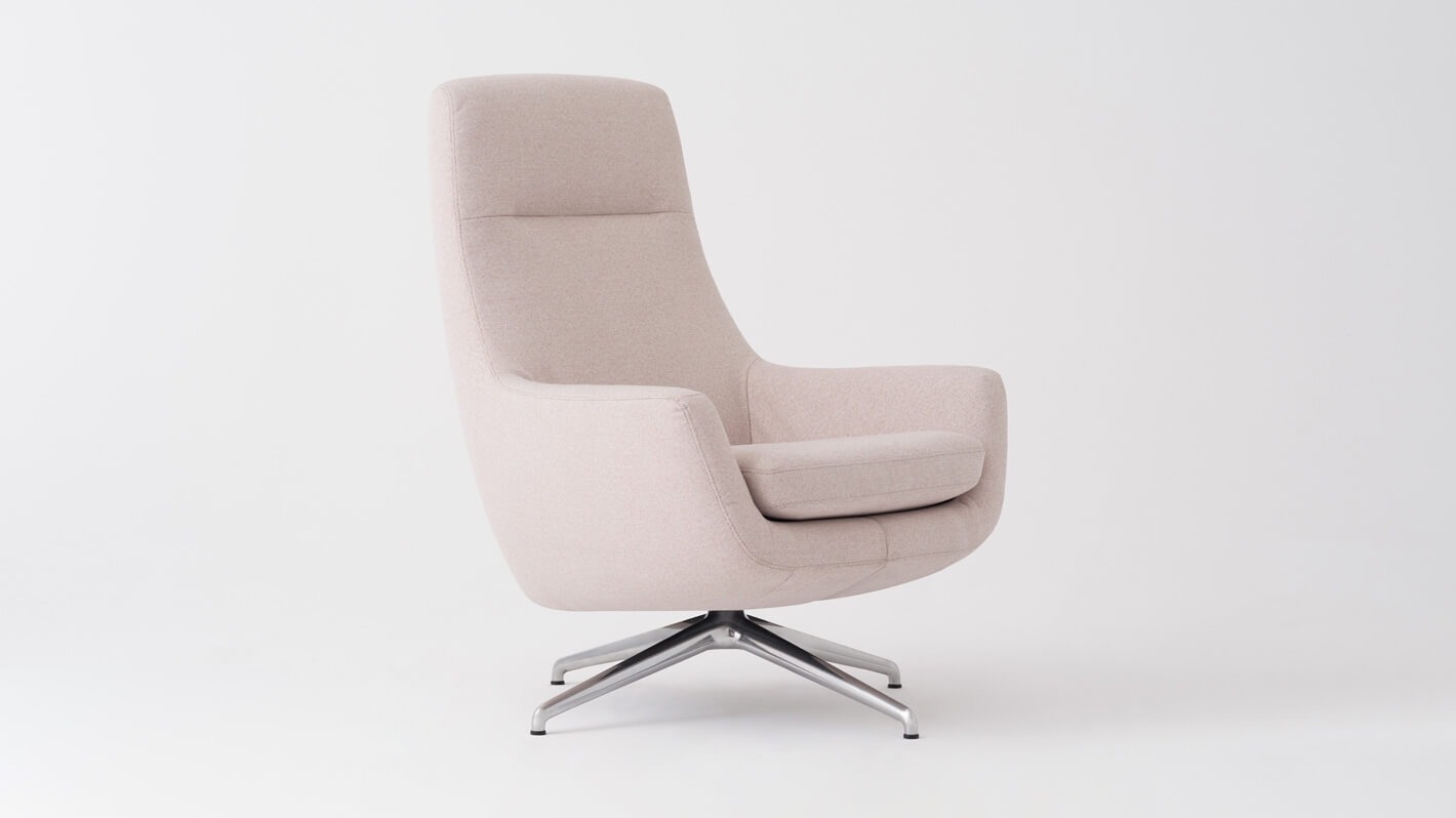 Angled view of the Suite modern lounge chair in white fabric