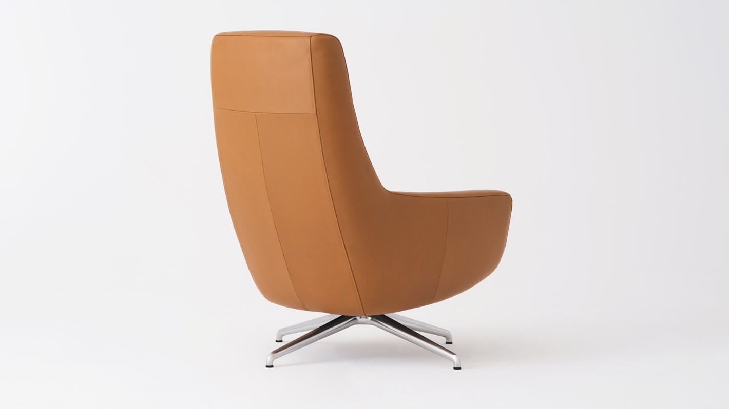 Back angled view of the Suite modern accent chair in brown leather