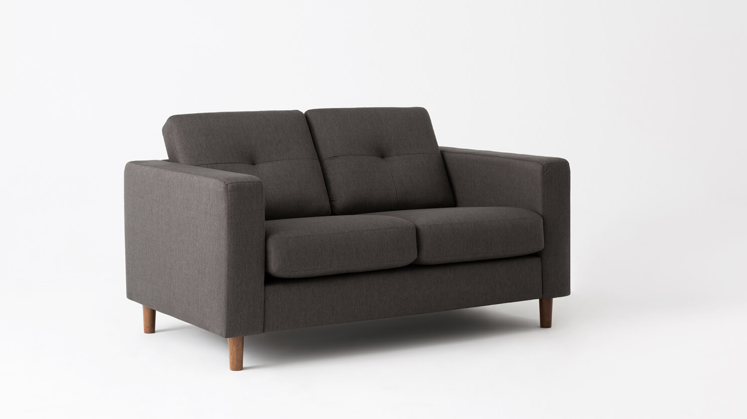 Angled view of the Solo mid century loveseat in grey fabric