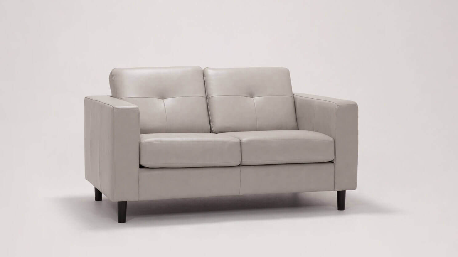 Angled view of the Solo mid century modern loveseat in grey leather