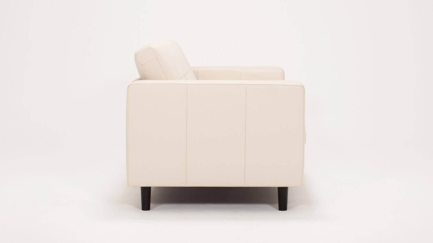 Side view of the Solo modern couch in white leather