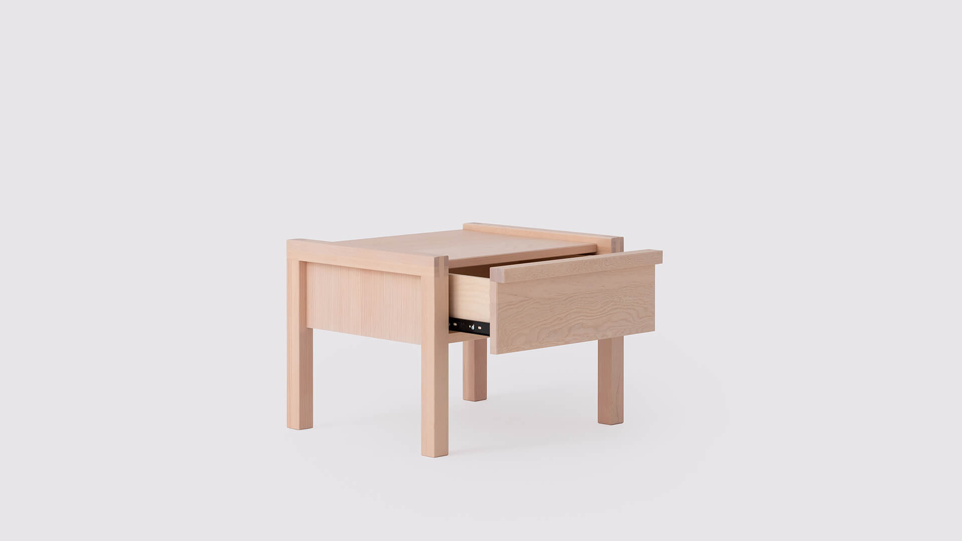 Angled view of the Ora solid wood modern nightstand with drawer open