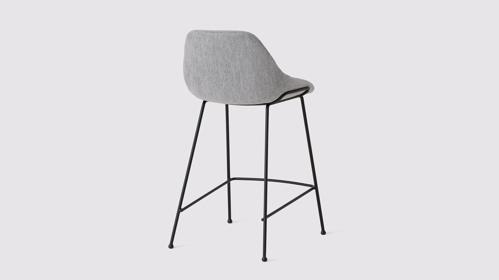 Back angled view of the Nixon custom bar stool in medium gray fabric