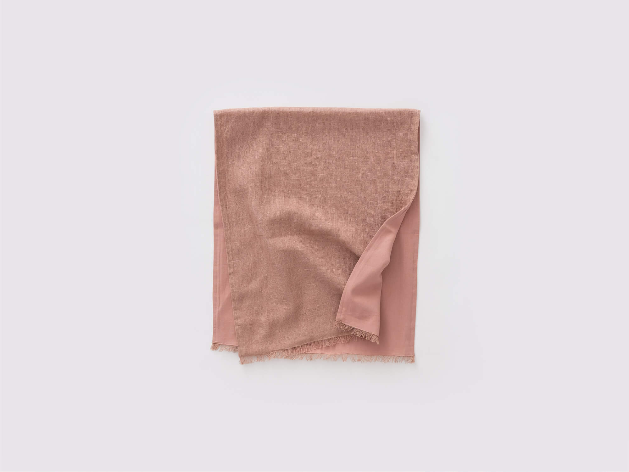 Overhead view of the Faye rustic table runner in rose unfolded