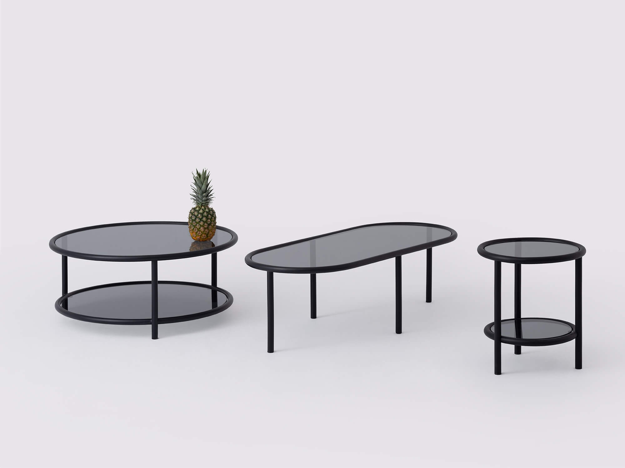 Black metal and glass end table, round coffee table, and oval coffee table front view