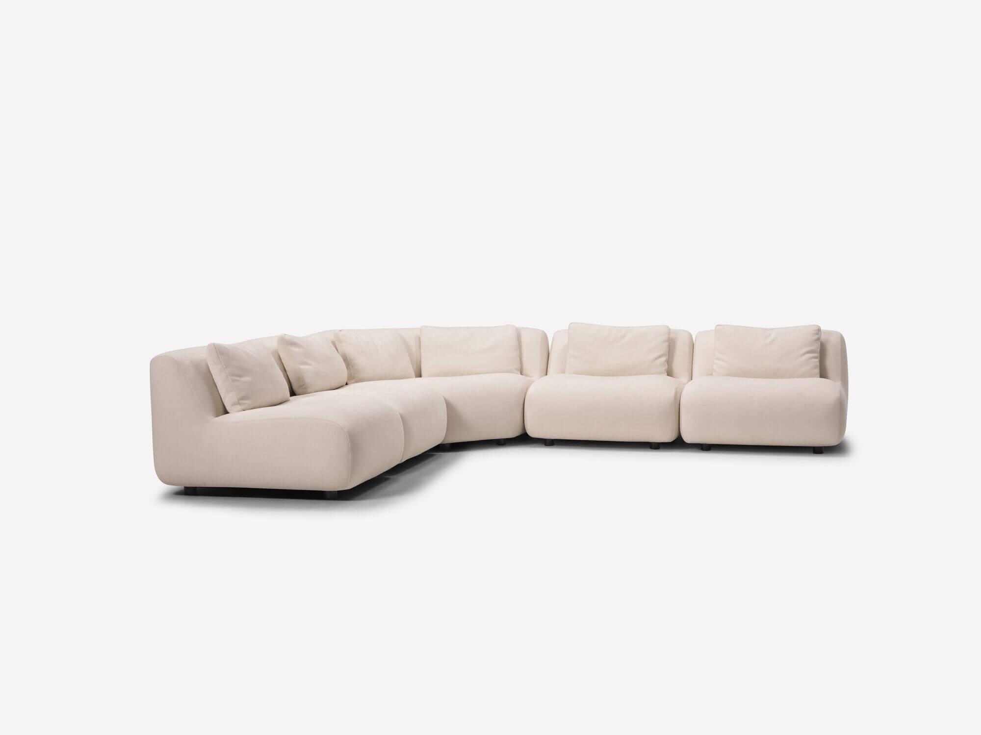 Front angle view of beige curved sectional