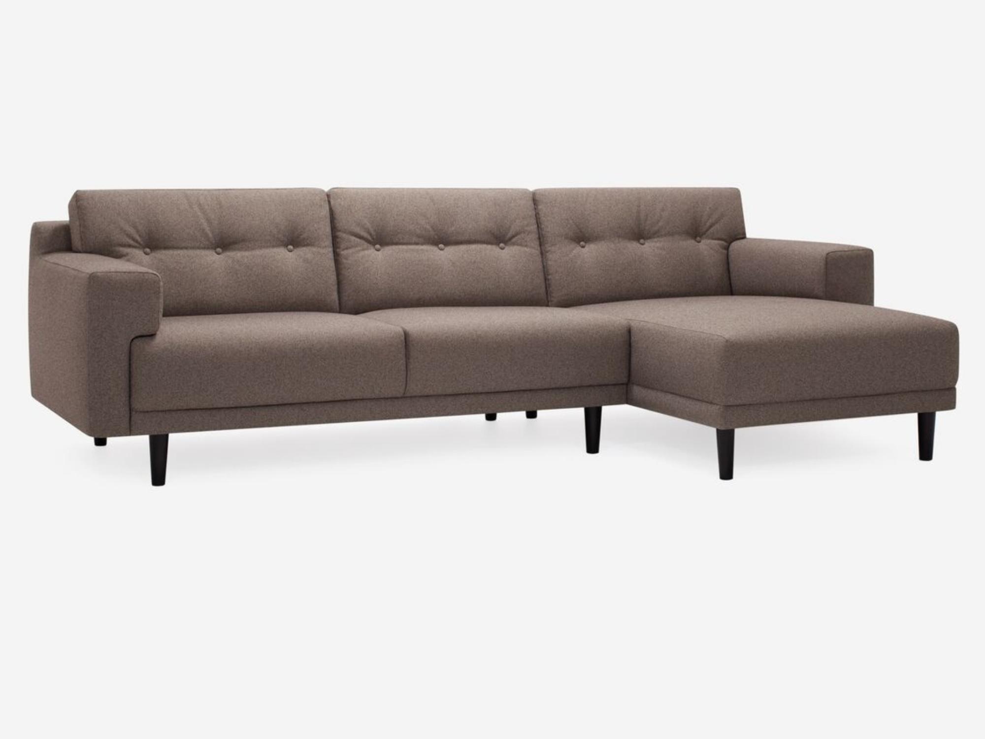 Angled view of the Remi 101" modern sectional sofa with buttons in grey fabric