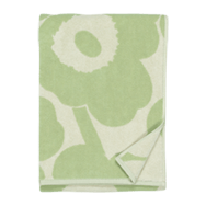 Green and white floral pattern folded towel top view