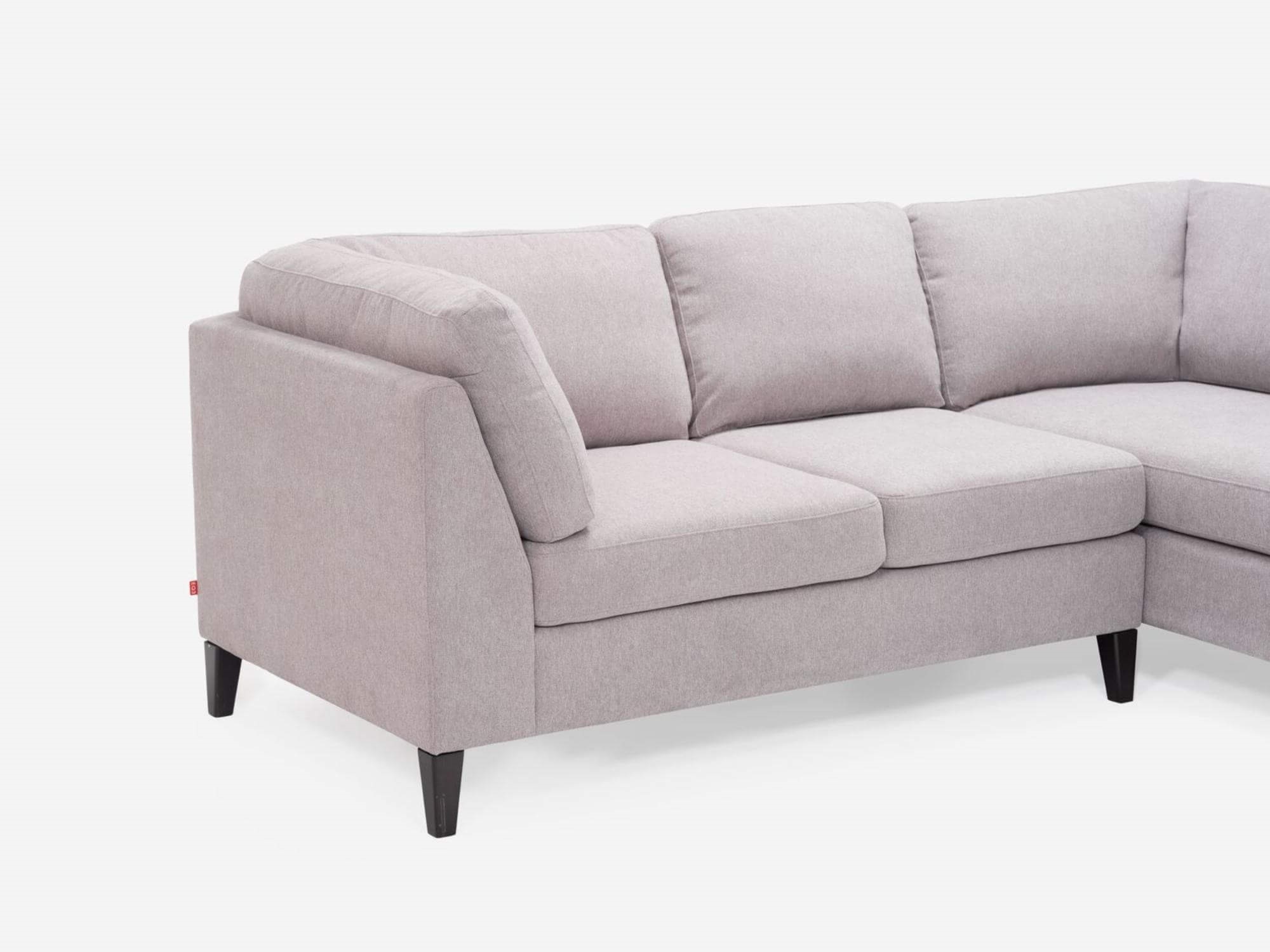 Detail arm view of the Salema modern sectional couch in grey fabric with right hand facing chaise