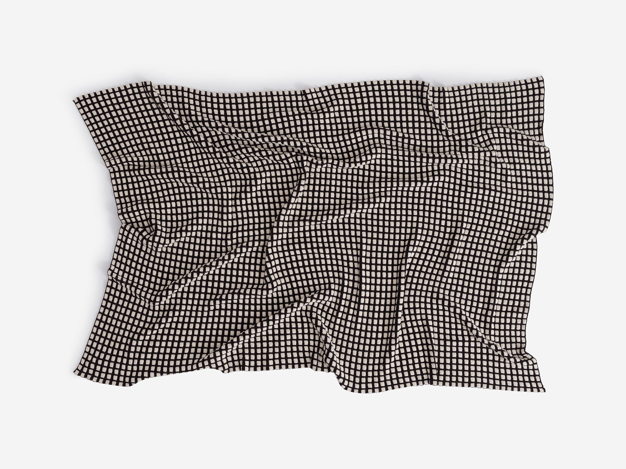 Top view of wrinkled check pattern throw blanket