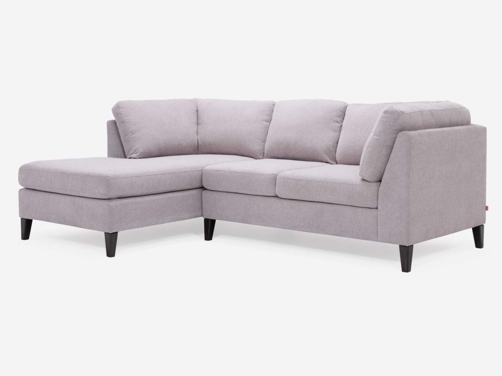Angled view of the Salema modular sofa in grey fabric