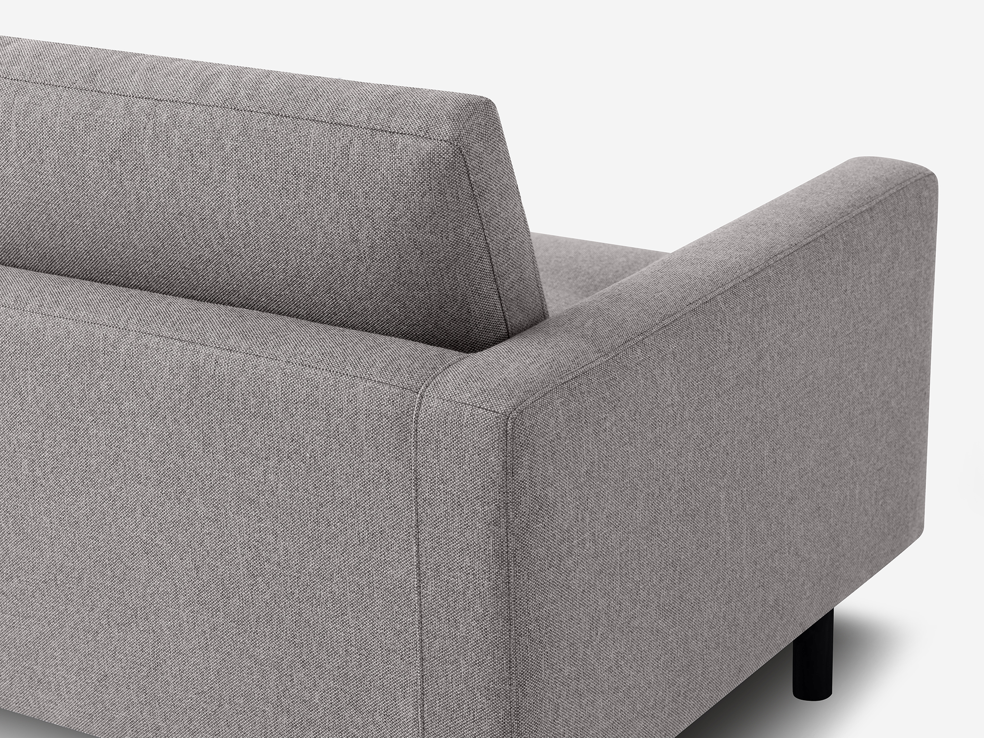 Detail view of the Joan contemporary chair upholstered in grey fabric